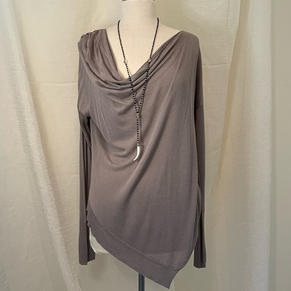Very chic light weight sweater. Drapes to one side for a very feminine look